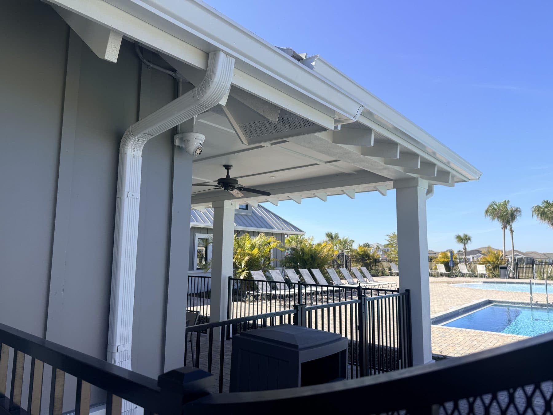 Camera covering a community amenity center and pool deck