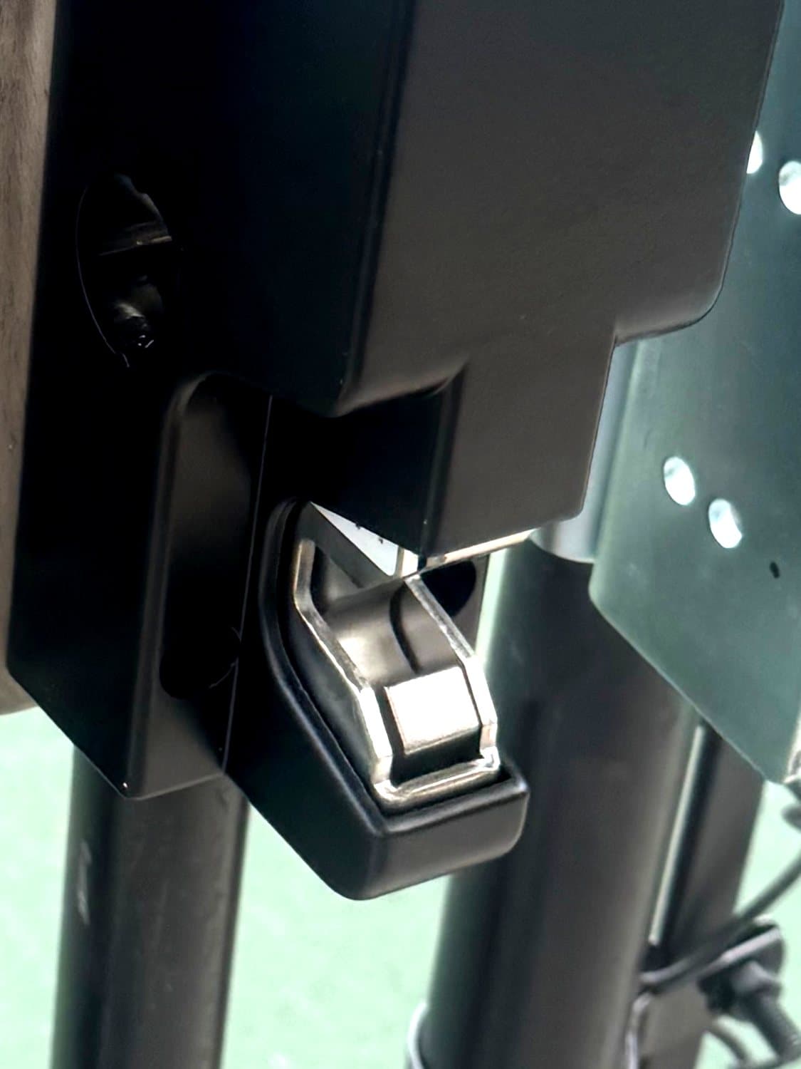 Electronic gate lock hardware installed at a community entrance